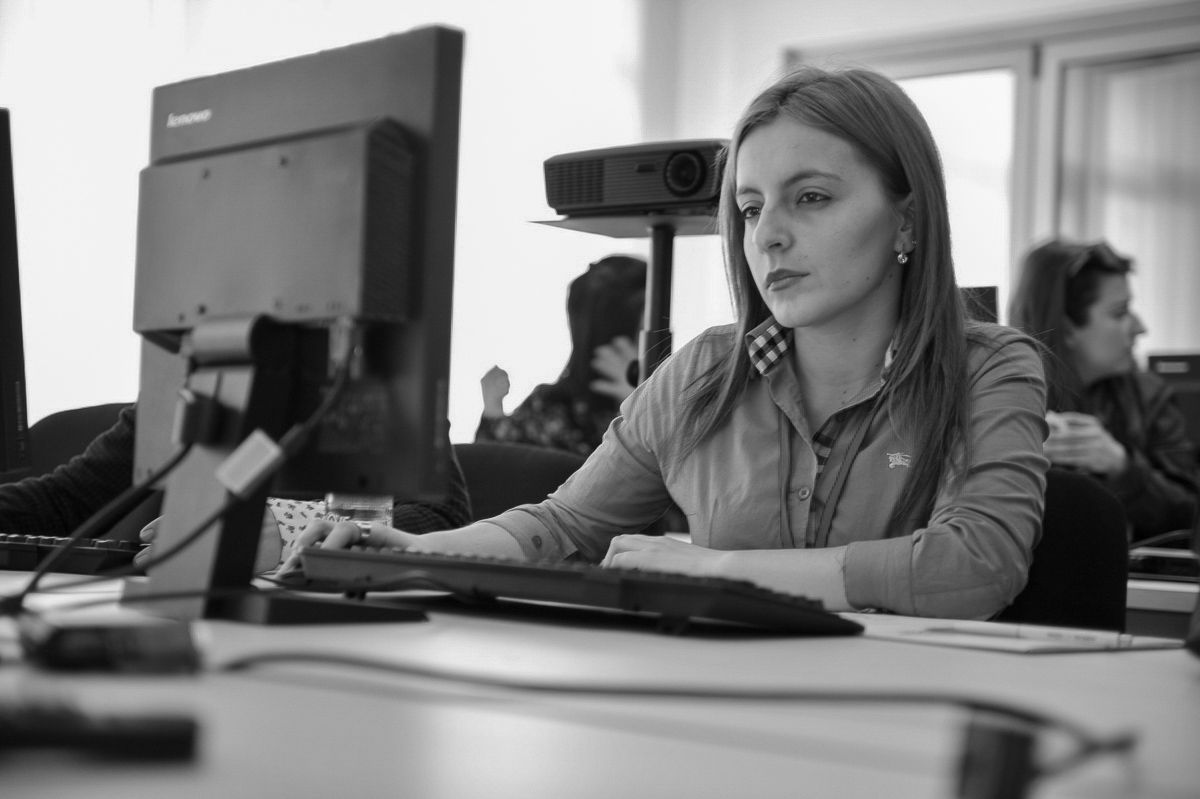 Woman does work on computer.