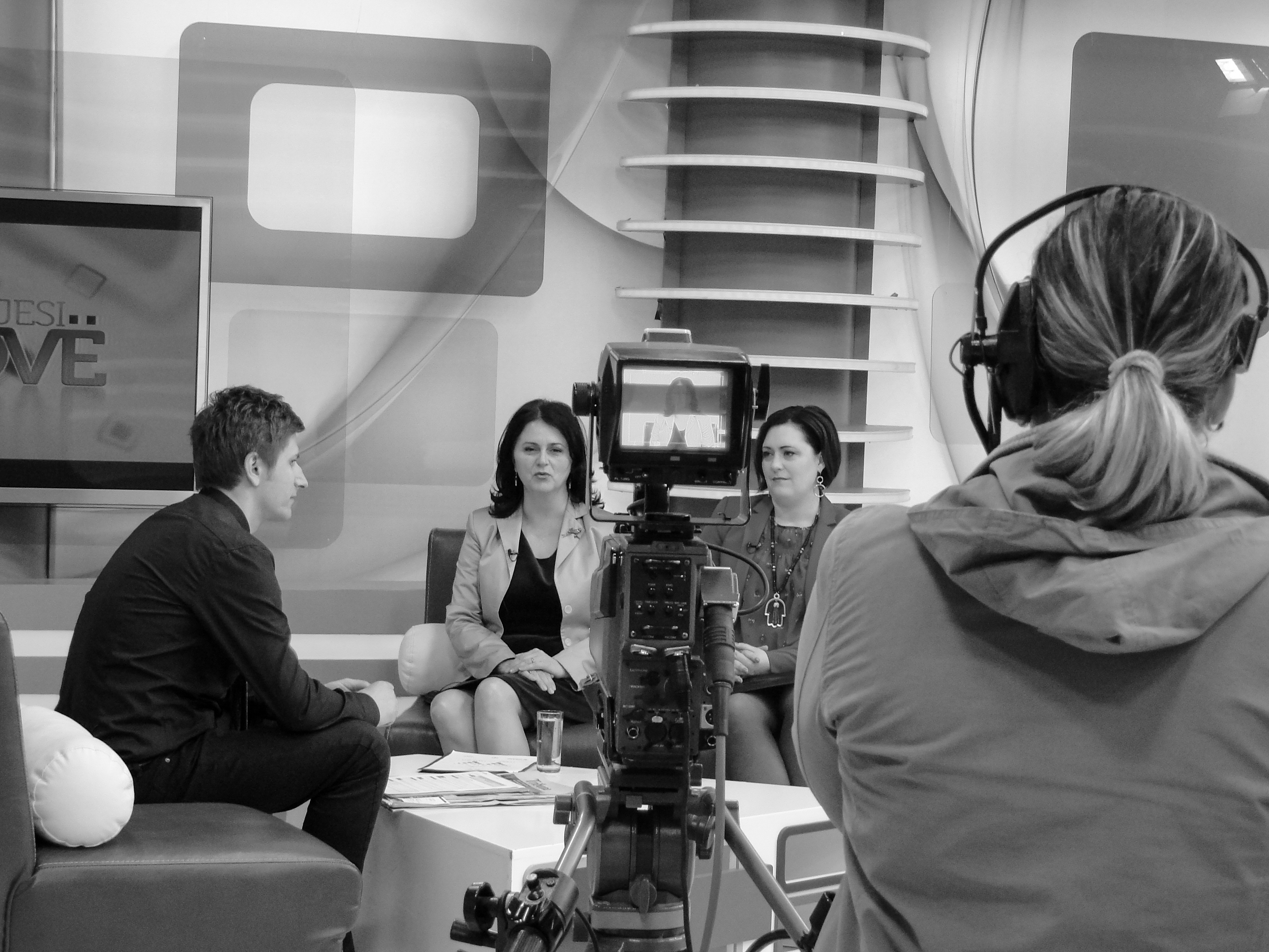 Two women interviewed in a television studio.